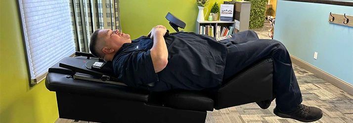 Chiropractic Bloomington IL Man In Decompression Machine